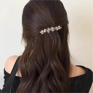 Woman wearing a white sparkly barrette hair clip for women