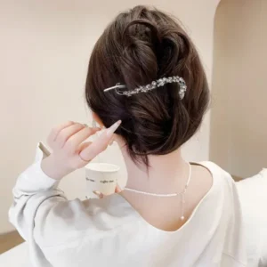 Woman wearing a stainless steel rhinestone banana hair clip at the back of her hair